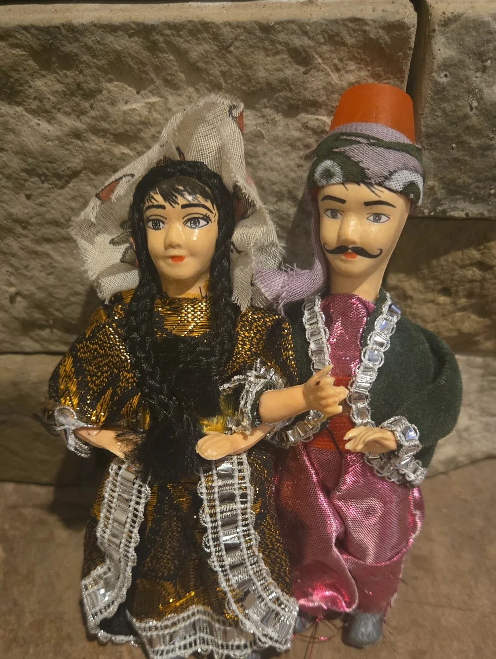 a pair of vintage Turkish souvenir dolls wearing traditional folkloric